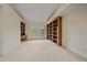 Bedroom features built in book shelves, neutral carpet and a large window for natural light and outside views at 787 W Meadow Rd, Evergreen, CO 80439
