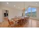 Bright dining room with mountain views through a large window at 787 W Meadow Rd, Evergreen, CO 80439