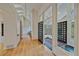 Bright foyer featuring hardwood floors, skylights, custom doors, and large windows to enjoy natural light at 787 W Meadow Rd, Evergreen, CO 80439
