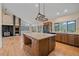 Well-lit kitchen featuring hardwood floors, a large island, and mountain views at 787 W Meadow Rd, Evergreen, CO 80439