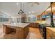 Bright kitchen with a large island, custom cabinets, and a black oven for gourmet cooking at 787 W Meadow Rd, Evergreen, CO 80439