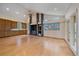 Spacious living room with hardwood floors, a fireplace, and large windows at 787 W Meadow Rd, Evergreen, CO 80439