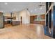 Open-concept living room features vaulted ceilings, hardwood floors, a fireplace, and spacious layout perfect for entertaining at 787 W Meadow Rd, Evergreen, CO 80439