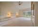 Bright and airy main bedroom boasts large windows, built-in storage, and plush carpeting at 787 W Meadow Rd, Evergreen, CO 80439