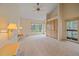 Spacious main bedroom featuring vaulted ceilings, built-in storage, and a private balcony with scenic views at 787 W Meadow Rd, Evergreen, CO 80439