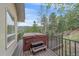 Relaxing outdoor hot tub on a private deck overlooking a picturesque mountain landscape at 787 W Meadow Rd, Evergreen, CO 80439