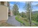 Paver patio offers private, outdoor living space with natural views at 787 W Meadow Rd, Evergreen, CO 80439