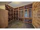 A climate controlled wine cellar with extensive custom wood racking and storage and slate floor at 787 W Meadow Rd, Evergreen, CO 80439