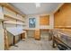 Well-lit work room with shelves and work benches for projects at 787 W Meadow Rd, Evergreen, CO 80439
