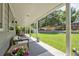Outdoor patio features covered seating and dining areas overlooking a well-maintained yard at 3843 S Quince St, Denver, CO 80237