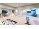 Spacious finished basement featuring a built-in entertainment center, a recreational area, and lots of storage options at 3843 S Quince St, Denver, CO 80237