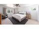 Bright bedroom with ceiling fan, large windows and neutral decor at 3843 S Quince St, Denver, CO 80237