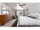 Bright bedroom featuring ceiling fan, large windows and neutral decor at 3843 S Quince St, Denver, CO 80237