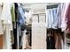 Walk-in closet with custom shelving and ample storage space at 3843 S Quince St, Denver, CO 80237