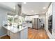 Bright and modern kitchen with stainless steel appliances, hardwood floors, and lots of natural light at 3843 S Quince St, Denver, CO 80237