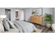 Relaxing bedroom with modern décor, sleek wood floors, ensuite bathroom, and comfortable bedding at 460 S Marion Pkwy # 1351, Denver, CO 80209