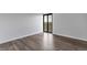 Modern bedroom features a brick accent wall and sliding glass doors to a patio at 460 S Marion Pkwy # 1351, Denver, CO 80209