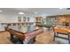 Game room with ping pong and pool tables and seating at 460 S Marion Pkwy # 1351, Denver, CO 80209