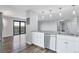 Modern kitchen with stainless steel appliances, sleek countertops, and an open layout connecting to the living area at 460 S Marion Pkwy # 1351, Denver, CO 80209