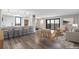 Inviting living space featuring a breakfast bar, bright windows, hardwood floors, and a relaxing seating area at 460 S Marion Pkwy # 1351, Denver, CO 80209