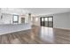 Stylish living space with hardwood floors and a breakfast bar leading to a balcony, offering views of the city at 460 S Marion Pkwy # 1351, Denver, CO 80209