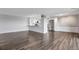 Bright living area with hardwood floors, an open kitchen with breakfast bar, and stylish lighting fixtures at 460 S Marion Pkwy # 1351, Denver, CO 80209