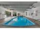 Indoor pool with ample seating, lifeguard equipment and windows at 460 S Marion Pkwy # 1351, Denver, CO 80209
