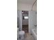 Bathroom view showing a toilet, bathtub, and sink area with access to the bedroom at 1560 Simms St, Lakewood, CO 80215