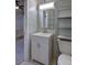 Well-lit bathroom features a sleek vanity and updated fixtures, offering a clean and modern feel at 1560 Simms St, Lakewood, CO 80215