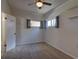Bright bedroom with cozy carpet, natural light, and neutral walls provides a comfortable and inviting space at 1560 Simms St, Lakewood, CO 80215