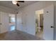 Spacious bedroom with multiple doorways provides versatile access and potential for customization at 1560 Simms St, Lakewood, CO 80215