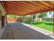 Backyard featuring a large covered patio, providing a comfortable space for relaxation and outdoor activities at 1560 Simms St, Lakewood, CO 80215