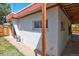 View from the back of this house, showcasing the yard, sidewalk and the street at 1560 Simms St, Lakewood, CO 80215