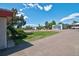 View from the side of this house, showcasing the yard, sidewalk and the street at 1560 Simms St, Lakewood, CO 80215