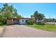 Charming single-story home with a spacious driveway and well-maintained lawn, perfect for a Gathering at 1560 Simms St, Lakewood, CO 80215
