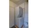 Efficient laundry setup with a stacked washer and dryer for space-saving convenience at 1560 Simms St, Lakewood, CO 80215