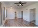 Inviting living area with hardwood floors, an overhead fan, and great natural light at 1560 Simms St, Lakewood, CO 80215