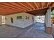 Large carport with ample parking and a partially fenced in yard at 1560 Simms St, Lakewood, CO 80215