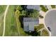 An aerial of a home, backyard, and the surrounding neighborhood at 551 Snowy Owl Pl, Highlands Ranch, CO 80126