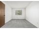 Empty bedroom with neutral carpet and paint at 551 Snowy Owl Pl, Highlands Ranch, CO 80126