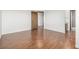Large bedroom featuring hardwood floors, a closet, and access to the bathroom at 551 Snowy Owl Pl, Highlands Ranch, CO 80126