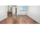Spacious bedroom features wood floor, mirror closet doors, and natural light at 551 Snowy Owl Pl, Highlands Ranch, CO 80126