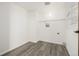Bright closet space with laminate floors and white shelving at 551 Snowy Owl Pl, Highlands Ranch, CO 80126