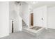 Bright entryway features a staircase and white door at 551 Snowy Owl Pl, Highlands Ranch, CO 80126