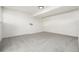 Spacious room with neutral carpet, white walls, and a modern ceiling light at 551 Snowy Owl Pl, Highlands Ranch, CO 80126