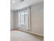 Bedroom with neutral carpeting and white drapes accenting a bright window at 23593 E Chenango Pl, Aurora, CO 80016