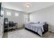 Bedroom with gray carpet features a writing desk, and small sitting area at 23593 E Chenango Pl, Aurora, CO 80016