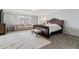 Large bedroom features large windows, seating area, and decorative furniture at 23593 E Chenango Pl, Aurora, CO 80016