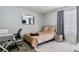 Bedroom featuring a full bed, stylish rug, modern mirror, and natural light from the window at 23593 E Chenango Pl, Aurora, CO 80016