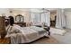 Large main bedroom with seating area, ensuite bathroom, and walk-in closet at 23593 E Chenango Pl, Aurora, CO 80016